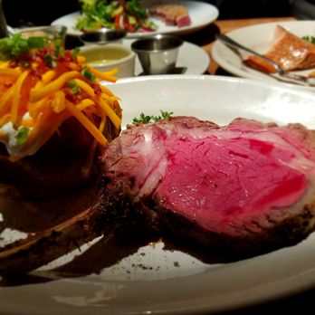 Houston's Restaurant - Prime rib medium rare with baked potato - New American Near Me - Irvine, California Houston's Restaurant - Prime rib medium rare with baked potato - New American Near Me - Irvine, California