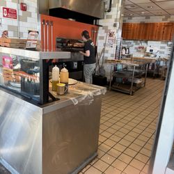 Blaze Pizza - Worker on phone