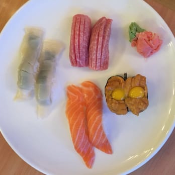Super Fusion Cuisine - Scallop sushi (left), fatty tuna sushi (top), Uni with quail egg (right), salmon sushi (bottom) - Sushi Bars Near Me - Brookline, Massachusetts Super Fusion Cuisine - Scallop sushi (left), fatty tuna sushi (top), Uni with quail egg (right), salmon sushi (bottom) - Sushi Bars Near Me - Brookline, Massachusetts