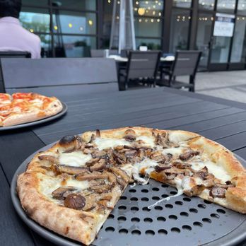 Pizzana - Preston Forest - The delicious authentic pizza served to us outside on the patio. They even have heaters ready to go when the temperature gets colder. - Italian Near Me - Dallas, Texas Pizzana - Preston Forest - The delicious authentic pizza served to us outside on the patio. They even have heaters ready to go when the temperature gets colder. - Italian Near Me - Dallas, Texas