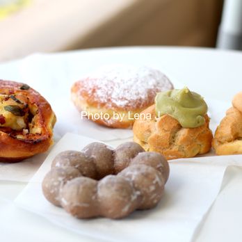 Liliha Bakery - Poi Mochi Donut ($3.19), Onion Roll ($2.89), Green Tea Puff ($3.75), Coco Puff ($3.69), Haupia Malasada ($4.25) - Bakeries Near Me - Honolulu, Hawaii Liliha Bakery - Poi Mochi Donut ($3.19), Onion Roll ($2.89), Green Tea Puff ($3.75), Coco Puff ($3.69), Haupia Malasada ($4.25) - Bakeries Near Me - Honolulu, Hawaii