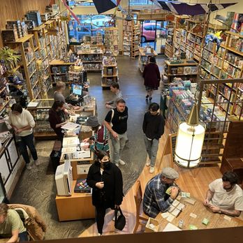 Blue Highway Games - View from upstairs of most of the downstairs area. - Hobby Shops Near Me - Seattle, Washington