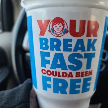 Wendy's - a hand holding a cup of fast food - Burgers Near Me - West Chester, Ohio Wendy's - a hand holding a cup of fast food - Burgers Near Me - West Chester, Ohio