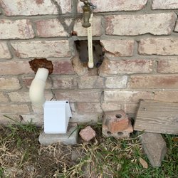 Parce Inspections - damage to brick wall, from bad plumbing job, plus washer drain to yard instead of being connected to sewer