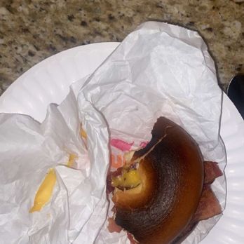 Dunkin - a half eaten sandwich on a paper plate - Donuts Near Me - Delaware, Ohio