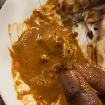 Tru India - Burnt Plastic Wrap with Butter Chicken - Indian Near Me - Katy, Texas Tru India - Burnt Plastic Wrap with Butter Chicken - Indian Near Me - Katy, Texas
