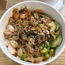 3 scoop bowl: brown rice, edamame, cucumbers, shrimp, salmon, crabmeat, seaweed flakes, crunchy onions, eel sauce, & Haus sauce.