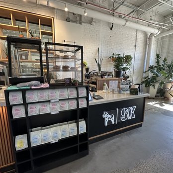 SK Coffee - a coffee shop with a counter and shelves - Coffee Roasteries Near Me - Saint Paul, Minnesota