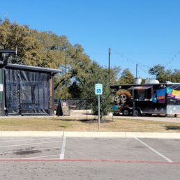 Main building with beverage service at left, food trucks at right Main building with beverage service at left, food trucks at right