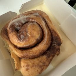 Orange blossom cinnamon roll with glaze melted off after a 10min drive home.