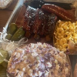 Pork ribs, jalapeño and cheddar sausage, bacon Mac and cheese, coleslaw Pork ribs, jalapeño and cheddar sausage, bacon Mac and cheese, coleslaw