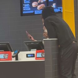 Worker on there phone while we waiting for our food