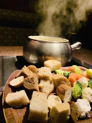 Photo of The Melting Pot - Houston - Houston, TX, US. Jalapeño & Bacon  cheese fondue served with artisan bread and season fruit and veggies
