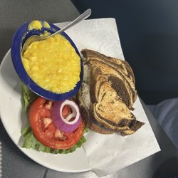 Chicken salad sandwich, creamed corn, and a HOME GROWN tomato slice.