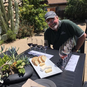 Georis Winery - My husband about to enjoy the cheese board and wines. - Wineries Near Me - Carmel Valley, California Georis Winery - My husband about to enjoy the cheese board and wines. - Wineries Near Me - Carmel Valley, California