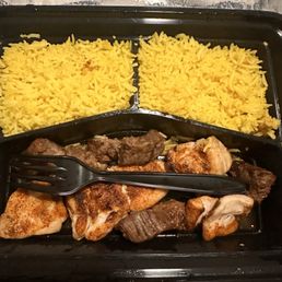 Steak and chicken with side of vegetables and rice pilaf Steak and chicken with side of vegetables and rice pilaf