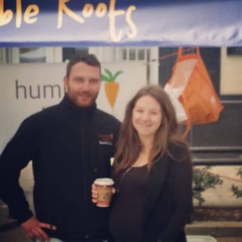 Humble Roots - a man and a woman standing under a tent - Cheese Shops Near Me - Greenville, South Carolina Humble Roots - a man and a woman standing under a tent - Cheese Shops Near Me - Greenville, South Carolina