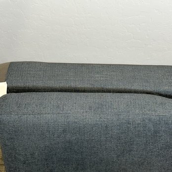 Living Spaces - Misshaped, poorly made Ottoman. Had metal clips and wood that you feel coming through the fabric. - Furniture Stores Near Me - Summerlin, Nevada