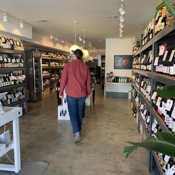 Monarch Wine Merchants - a woman walking through a wine store - Beer, Wine & Spirits Near Me - Charleston, South Carolina Monarch Wine Merchants - a woman walking through a wine store - Beer, Wine & Spirits Near Me - Charleston, South Carolina