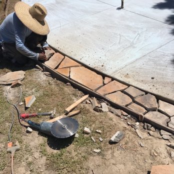 California Coast Contracting - Installed custom rock border - Landscaping Near Me