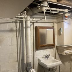 Pease Plumbing - Before Repipe. Customer wanted pipes going down wall consolidated