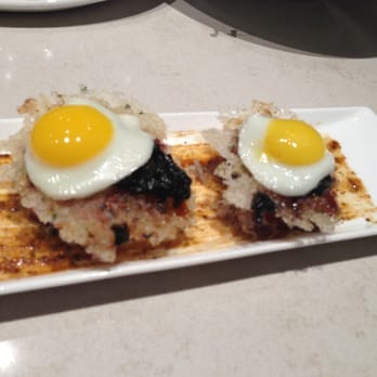 MW Restaurant - The famous quail egg spam musubi with nori paste on fried mochi. - New American Near Me - Honolulu, Hawaii