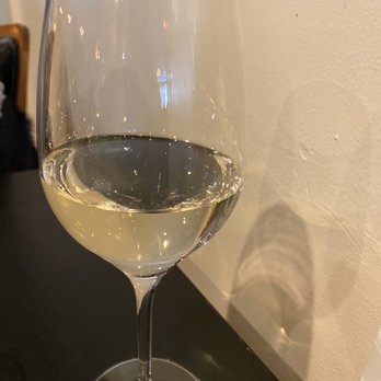 Kitchen Proper - A glass of Sauvignon Blanc. - Salad Near Me - Battle Creek, Michigan