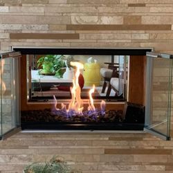 Colorado Fireplace Service & Repair - Customer asked us to install the custom door set, as well as clean and service the log set.