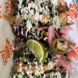 Pork taco with cheese(Gordita I think) and steak street taco Pork taco with cheese(Gordita I think) and steak street taco