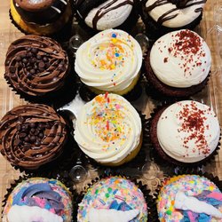 Twisted Sisters Cupcakes  - Top left to right (some kind of vanilla & chocolate; oreo; PB brownie; chocolate; vanilla; red velvet; unicorn.
