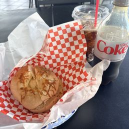Asiago bagel toasted with plain cream cheese and a Diet Coke.