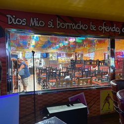 Tacos & Beers - The window from bar area looking into fast food eatery side