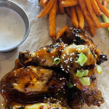 Twin Peaks - Smoked & grilled wing with spicy Thai chili sauce and sweet potato fries - New American Near Me - Oklahoma City, Oklahoma Twin Peaks - Smoked & grilled wing with spicy Thai chili sauce and sweet potato fries - New American Near Me - Oklahoma City, Oklahoma