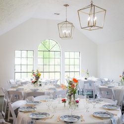 Serenity Rose - Farmhouse Event Venue. Light and Airy wedding. Event venue with large windows and shabby chic decor and wildflowers