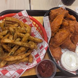 Fries and pok pok wings combo with yanch sauce Fries and pok pok wings combo with yanch sauce