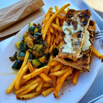 California Fish Grill - Closeup of my 2 sides underneath: Rosemary Zucchini & French Fries. The fries were great, but the oily Rosemary Zucchini tasted too bitter. - Seafood Near Me - Pasadena, California California Fish Grill - Closeup of my 2 sides underneath: Rosemary Zucchini & French Fries. The fries were great, but the oily Rosemary Zucchini tasted too bitter. - Seafood Near Me - Pasadena, California