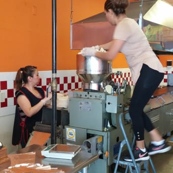 San Pedro Limon - Two women handle the quality control of the tortillas. If they come out uneven they are rolled up and rerun....before they are cooked - Mexican Near Me - Georgetown, Texas San Pedro Limon - Two women handle the quality control of the tortillas. If they come out uneven they are rolled up and rerun....before they are cooked - Mexican Near Me - Georgetown, Texas
