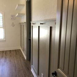 Arterior Designs - Board and Batten with custom floating shelves.