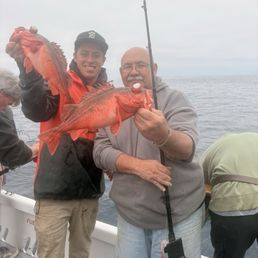 Rockfish caught by Jim and Captain Matt helping show them off Rockfish caught by Jim and Captain Matt helping show them off