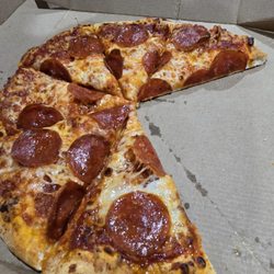 Domino's Pizza - But we handed it back, and they sliced it.