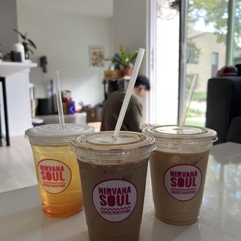 Nirvana Soul Coffee - Left to right: Serotonin Sunrise, Hazelnut Mocha and Honey Lavender Latte - Coffee & Tea Near Me - Cupertino, California Nirvana Soul Coffee - Left to right: Serotonin Sunrise, Hazelnut Mocha and Honey Lavender Latte - Coffee & Tea Near Me - Cupertino, California