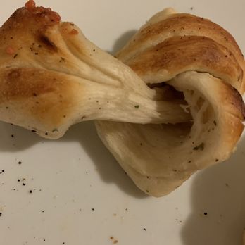 Pontillo's Pizzeria - Dry and old garlic knot, as you can see no garlic flavor visible and no moisture and little seasoning - Pizza Near Me - Cortland, New York Pontillo's Pizzeria - Dry and old garlic knot, as you can see no garlic flavor visible and no moisture and little seasoning - Pizza Near Me - Cortland, New York