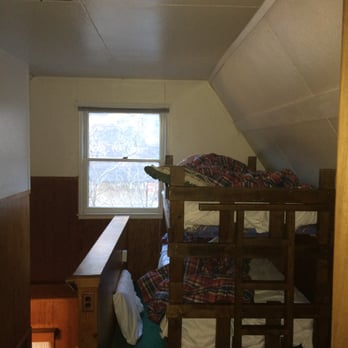 Grey Squirrel Resort & Vacation Rental Homes - This was one of "bedrooms" at the Molly cabin. Why would they put bunk bed next to stair way? This was so dangerous, kids were so scared. - Big Bear Lake, CA