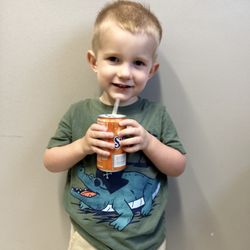 Fish Comb Barbering Club - Fresh cut and a celebratory orange drink!