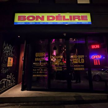 Bon Délire - a neon sign in the window of a restaurant - Bars Near Me - Montreal, Quebec Bon Délire - a neon sign in the window of a restaurant - Bars Near Me - Montreal, Quebec