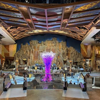 Mohegan Sun - View at top of escalator looking towards waterfall and bar area. - Hotels Near Me - Uncasville, Connecticut