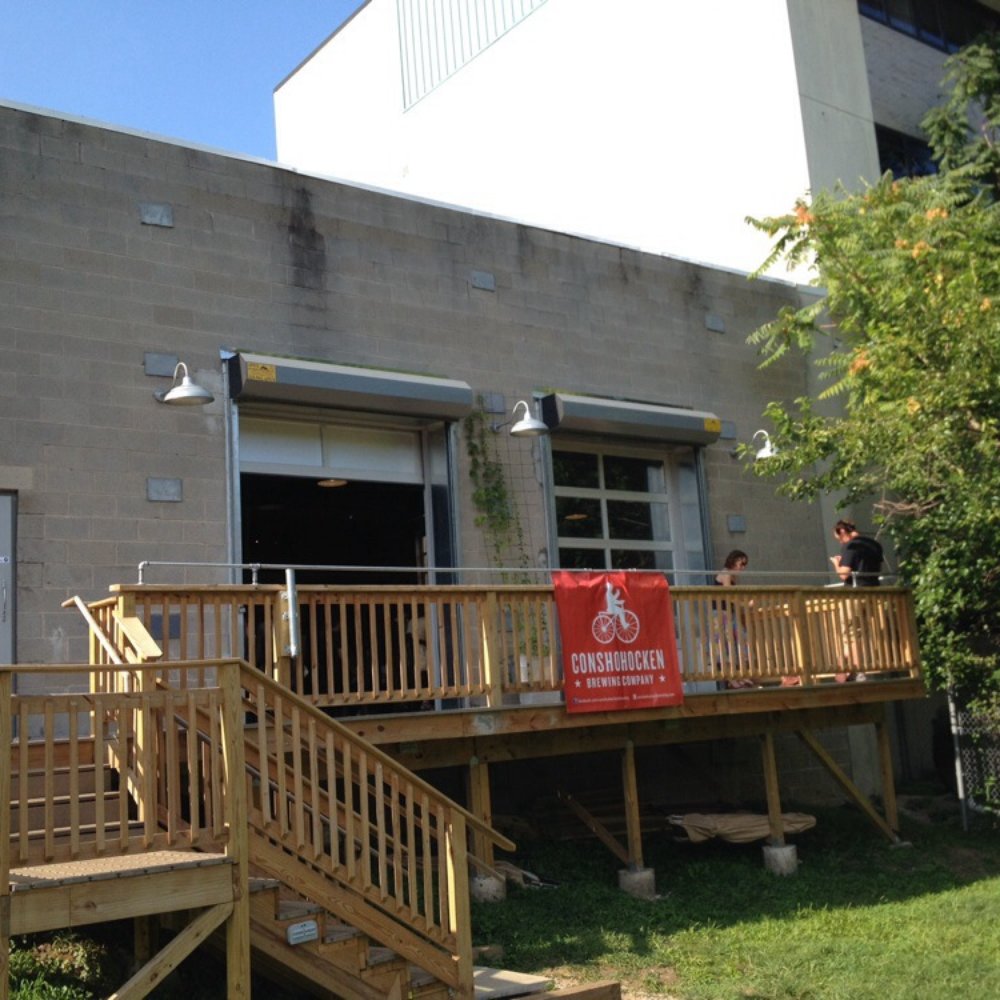 Conshohocken Brewing Company - View of the deck from the trail - Breweries Near Me - Conshohocken, Pennsylvania Conshohocken Brewing Company - View of the deck from the trail - Breweries Near Me - Conshohocken, Pennsylvania