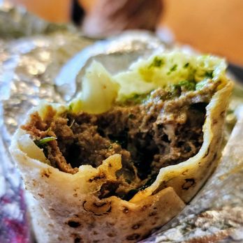 Spice Waala - Lamb Kebab Roll, ground halal lamb patties with cilantro chutney & pickled onions, wrapped in roti ($9, 1/10/25) - Indian Near Me - Seattle, Washington Spice Waala - Lamb Kebab Roll, ground halal lamb patties with cilantro chutney & pickled onions, wrapped in roti ($9, 1/10/25) - Indian Near Me - Seattle, Washington