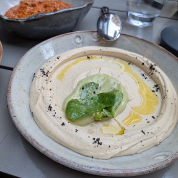 Rumi's Kitchen - Colony Square - Green Tahini Hummus. $14. Watercress, Urfa chili. - Persian/Iranian Near Me - Atlanta, Georgia
