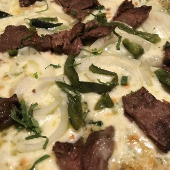 California Pizza Kitchen - Carne Asada (close up) - Pizza Near Me - Jacksonville, Florida California Pizza Kitchen - Carne Asada (close up) - Pizza Near Me - Jacksonville, Florida